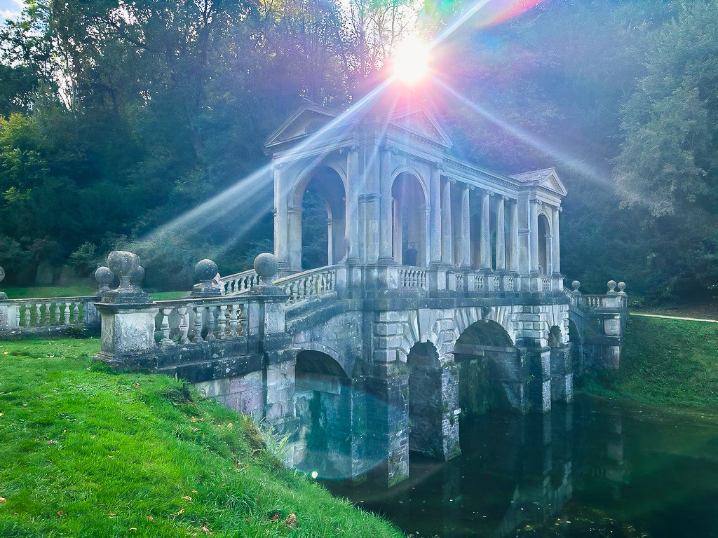 Sunlight over the Palladian bridge at Prior Park in Bath