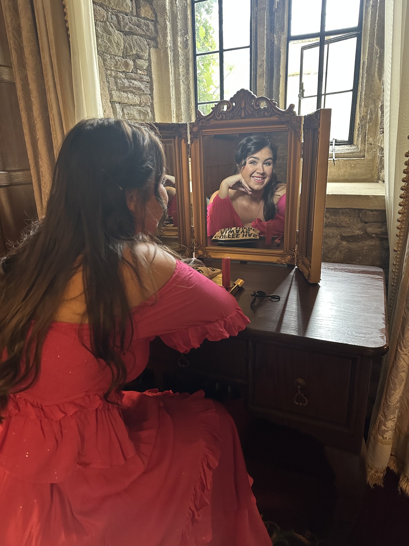Me in a red dress, reflected in an antique mirror